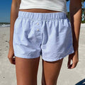 Casual vacation-ready striped shorts styled with crop top