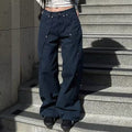 Close-up of the rivet details on the thigh area of the cargo denim pants.