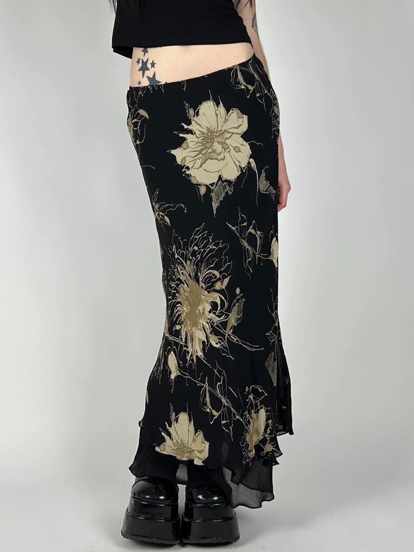 Close-up of the mesh fabric highlighting the intricate dark floral print.