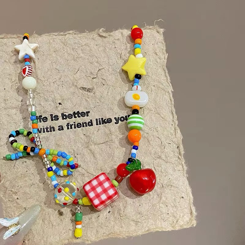 Colorful beaded choker necklace with sweet fruit and bow details, perfect for Y2K fashion, dopamine dressing, and kawaii jewelry lovers
