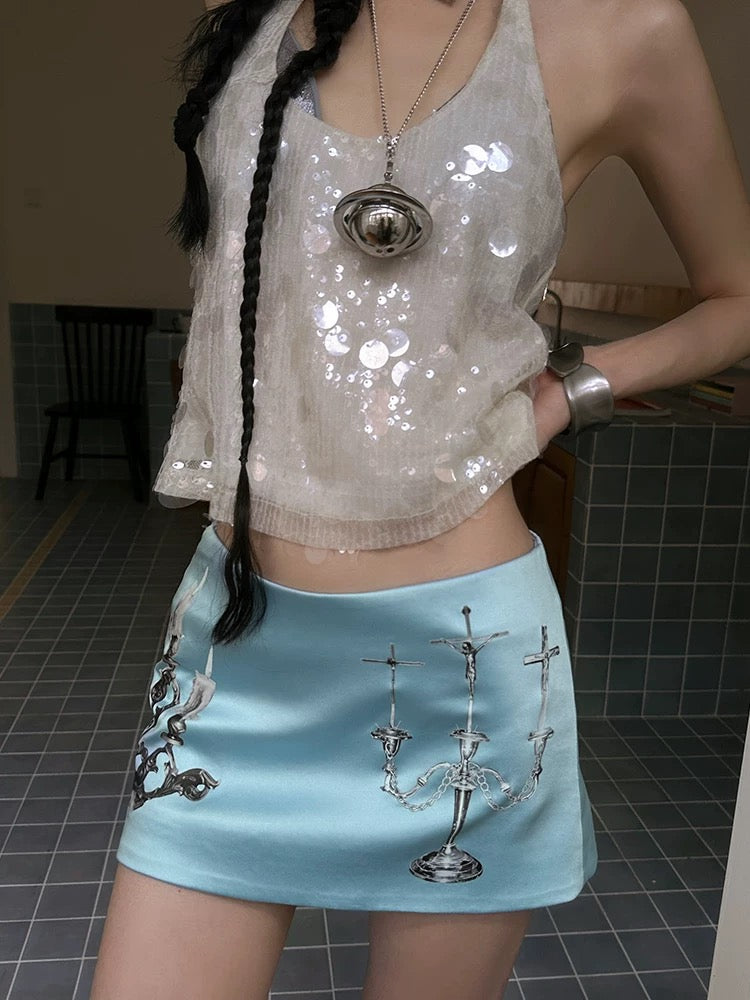 Y2K-inspired coquette fashion mini skirt with candlestick print