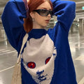 Gothic-inspired pullover sweater in dark blue with horror graphic art and a loose, oversized fit
