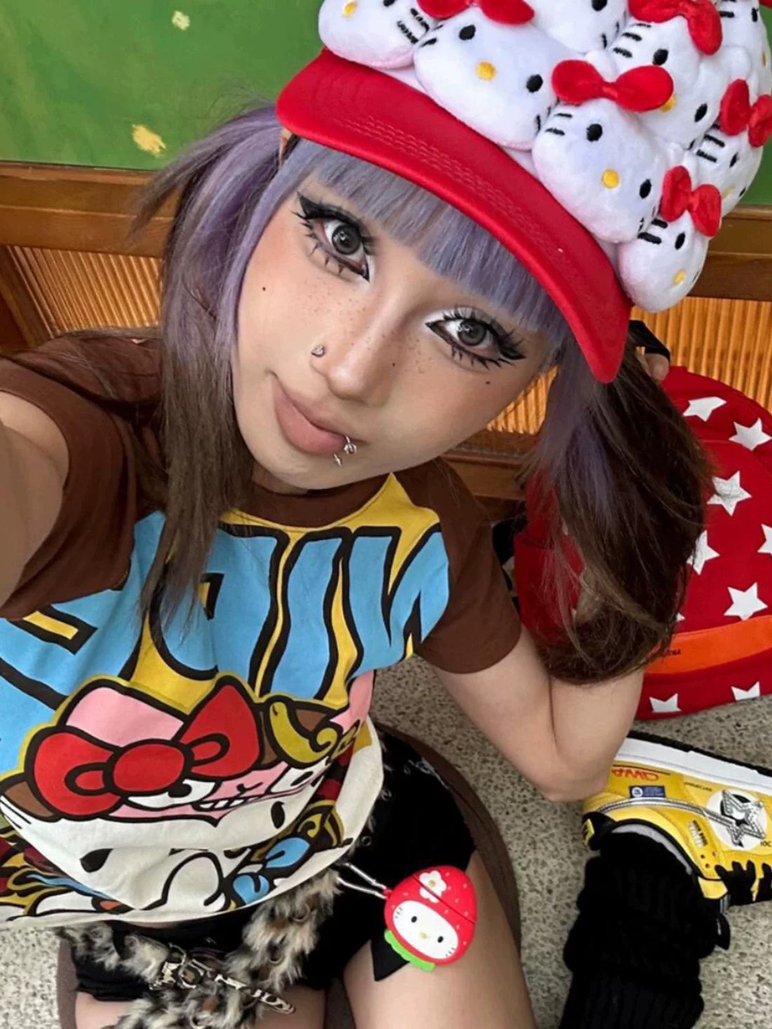 Kawaii Hello-Kitty inspired graphic tee with brown raglan sleeves and bold yellow comic print