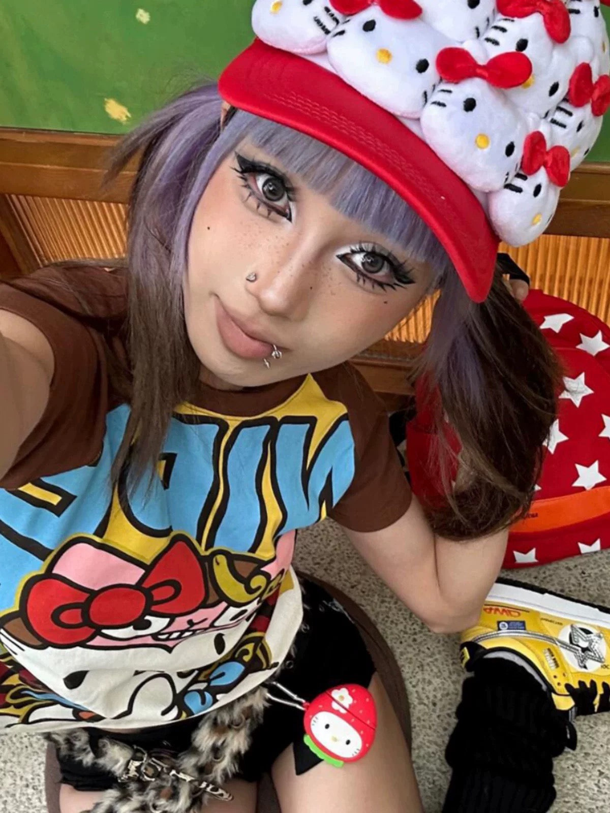 Streetwear outfit featuring the kawaii anime t-shirt styled with black shorts and leg warmers.