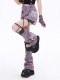 Close-up of purple lace-up denim mini skirt styled with leg warmer extension and streetwear shoes