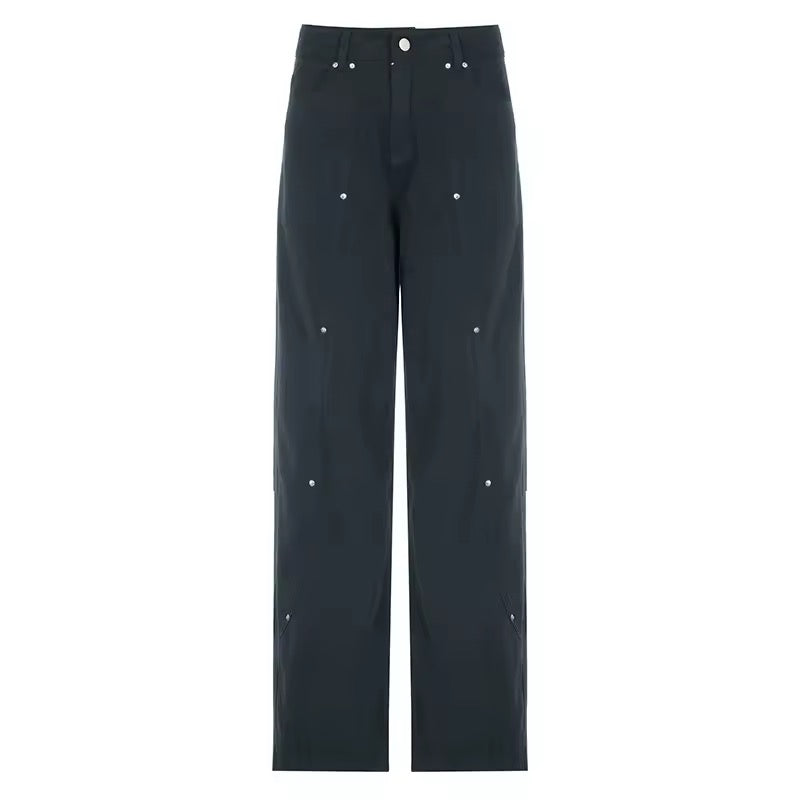 Front view of black low-waisted Y2K cargo jeans with silver rivets and wide-leg cut.