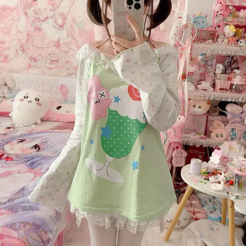 Close-up of the cute cartoon print on a pastel green shirt