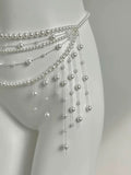 Y2K pearl waist chain with tassels styled over white dress