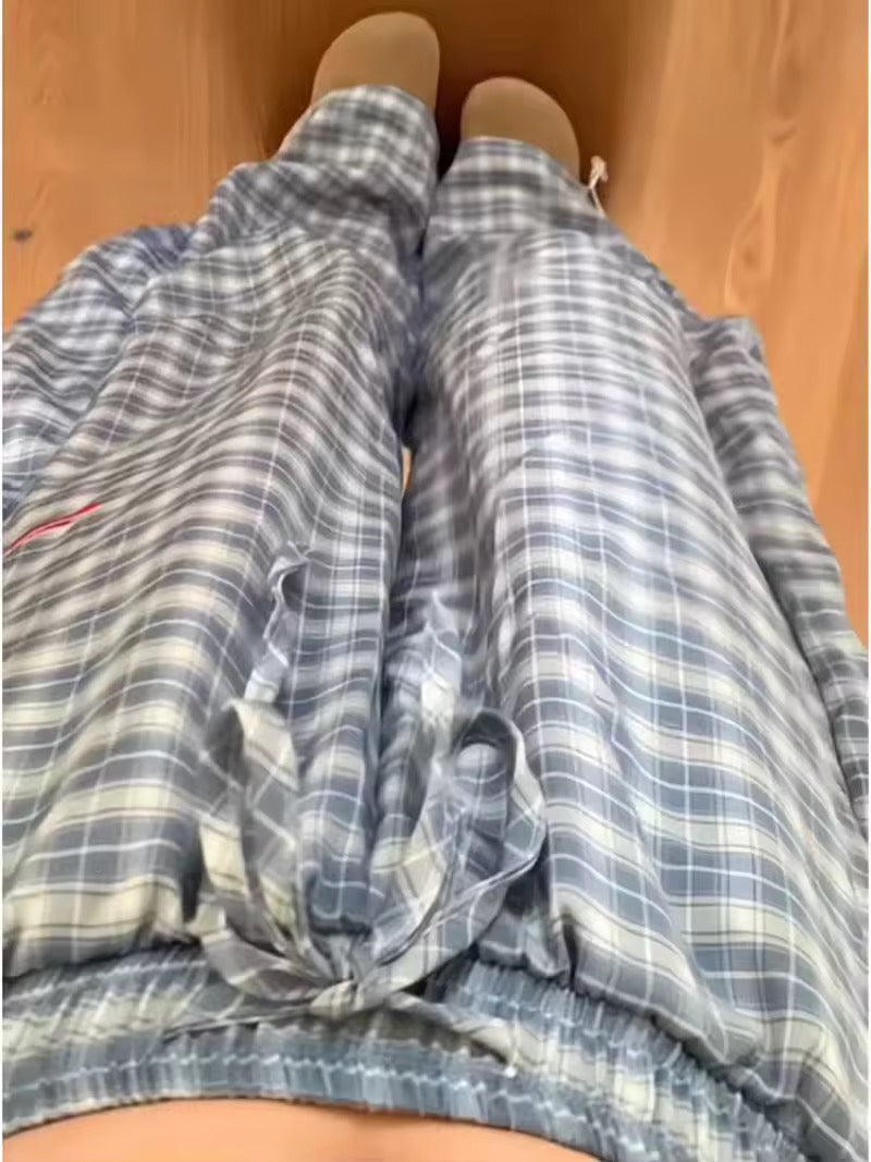 Light blue plaid pants styled in soft grunge vibe for spring street fashion