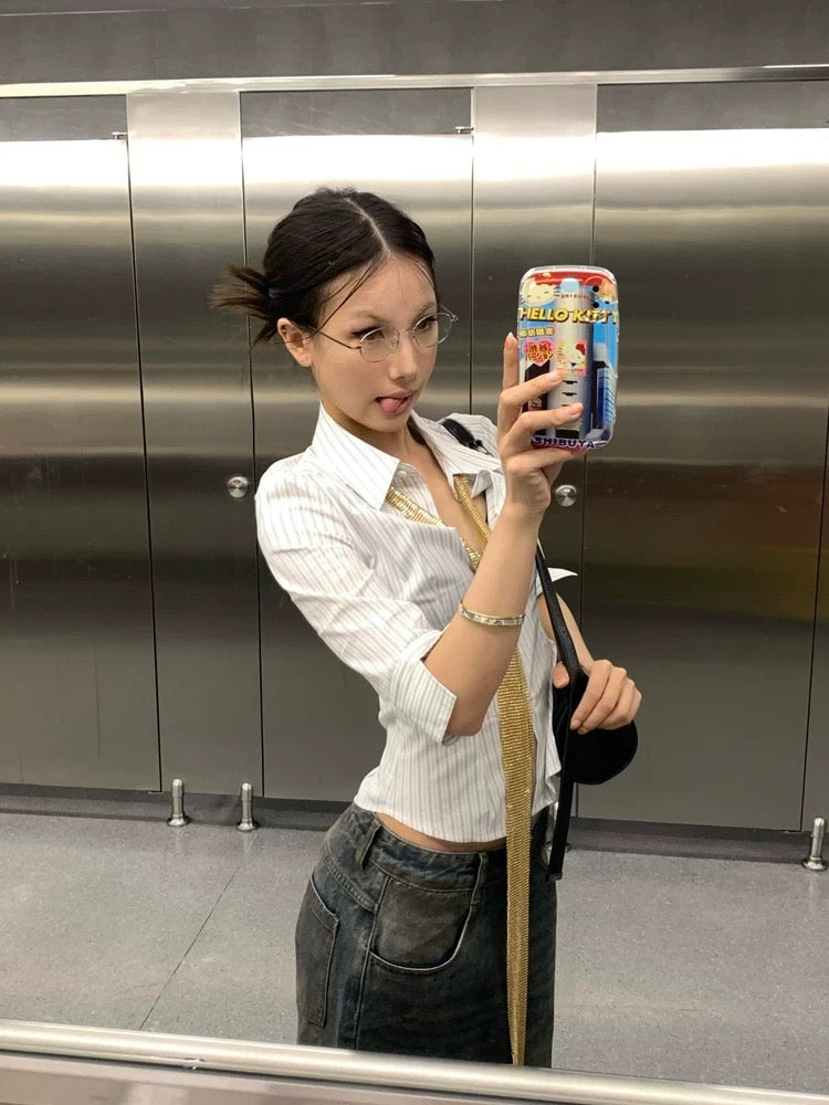 Korean streetwear outfit featuring the striped blouse with high-waisted jeans
