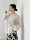 Side angle displaying the skirt's elegant drape and mid-length cut.