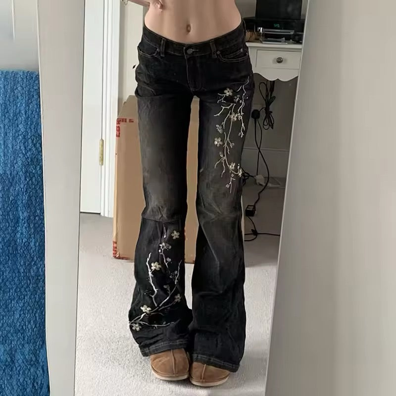 Low-rise 2000s vintage flared jeans with floral details