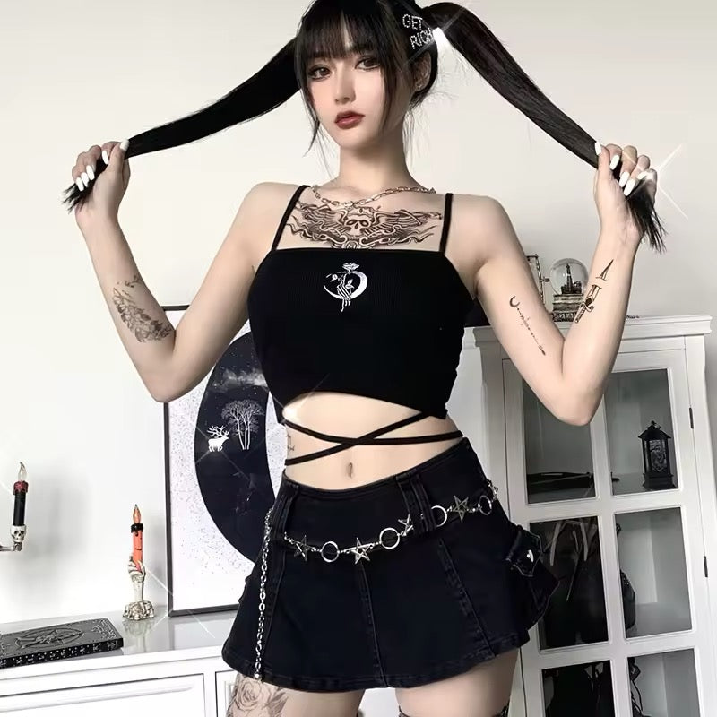Model wearing witchcore halter crop with tattoos