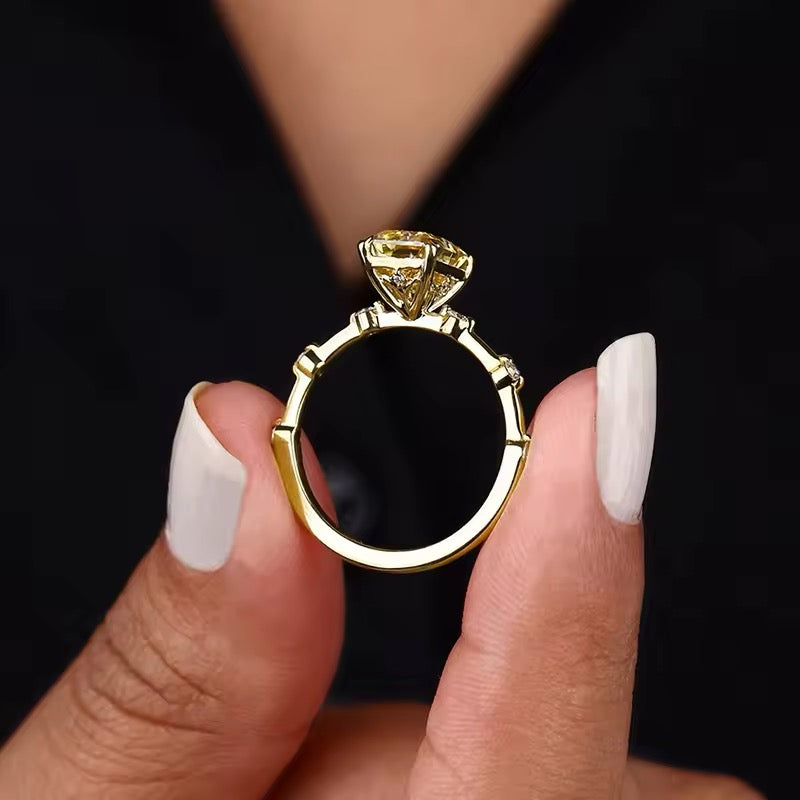 Close-up of yellow zirconia ring in silver band